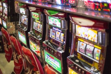 Mega Sevens slot game interface on mobile phone showing reels and bet controls